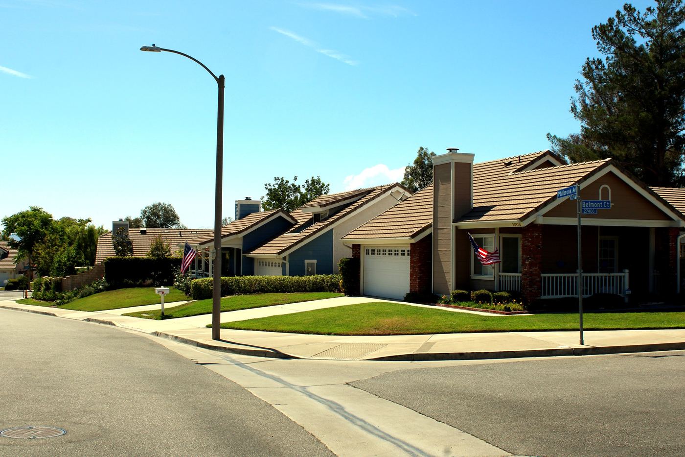 Single-story home on a quiet street in Valencia, Santa Clarita, with a well-kept front lawn