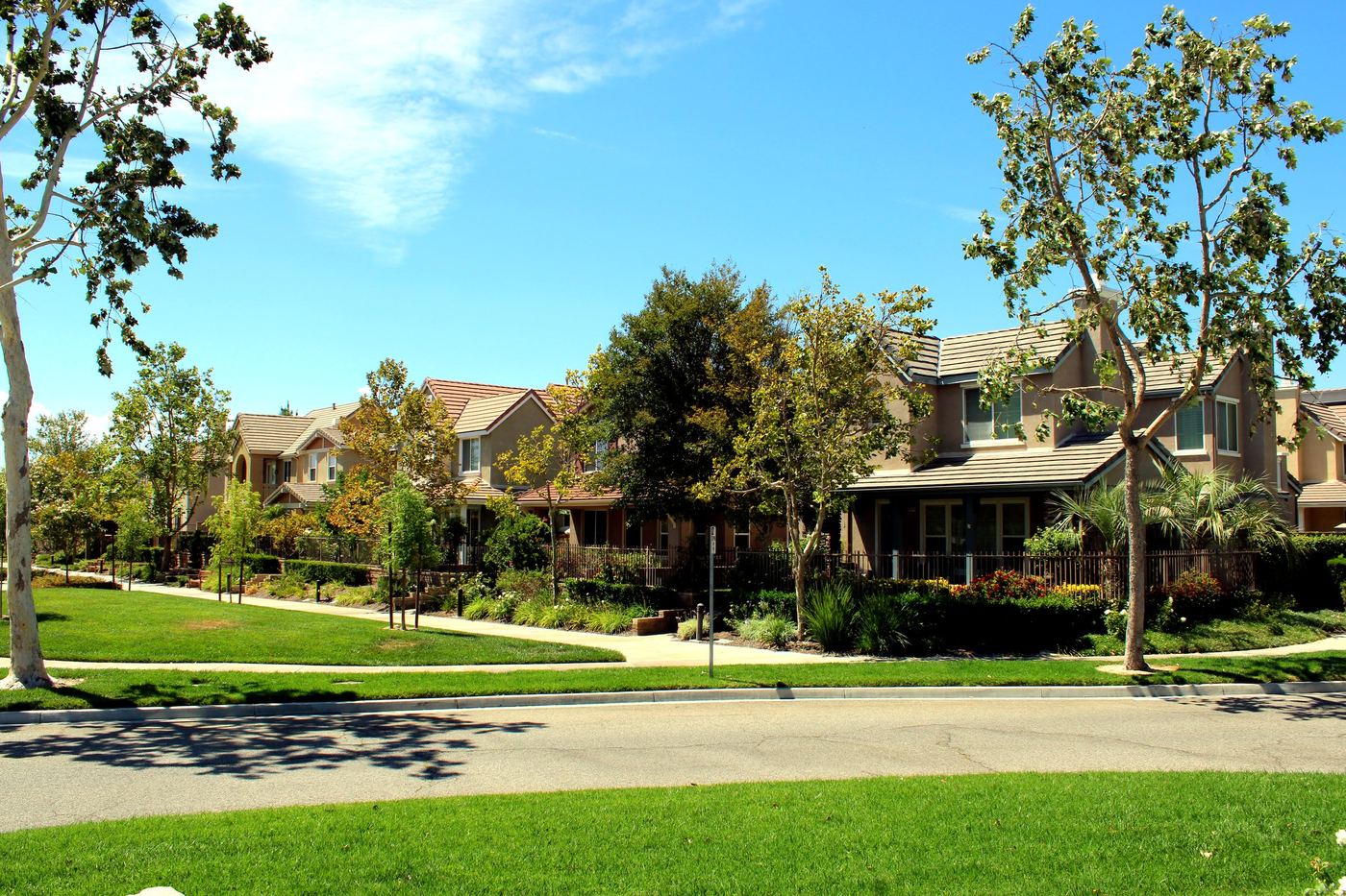 Tree-lined street of two-story homes in the Creekside neighborhood of Valencia, Santa Clarita